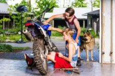 Kids repairing a motocross